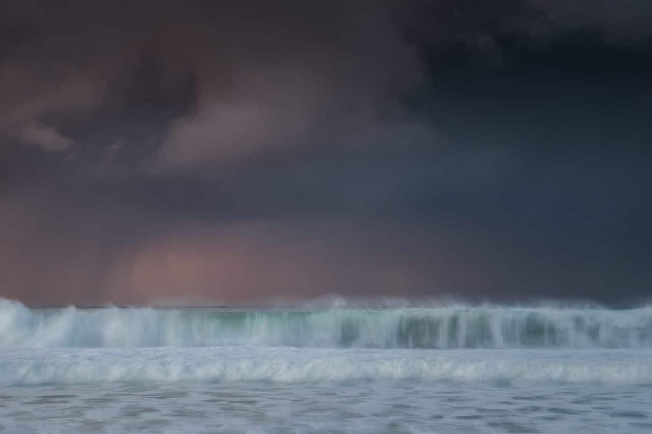 waves on scarista beach with stormy sky