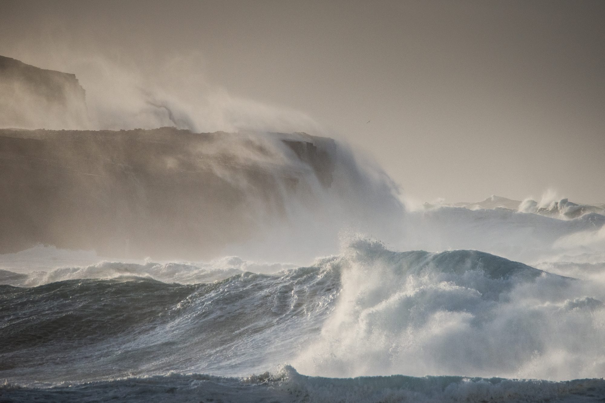 stormy seas hitting cliffs on orkney at skaill bay